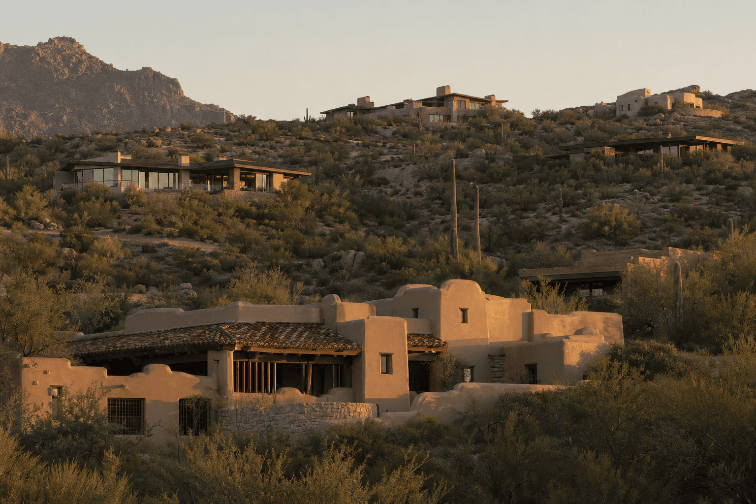Hillside custom homes in the high desert showing varied roof forms and materials.